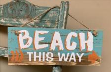 Beach This Way Sign .